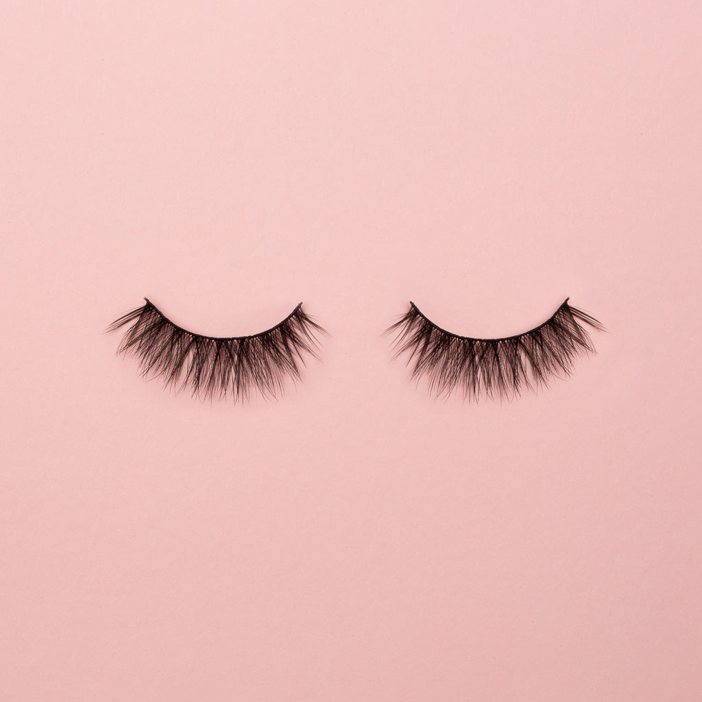 Pair of black bold false eyelashes. Peacocking high volume eyelash style