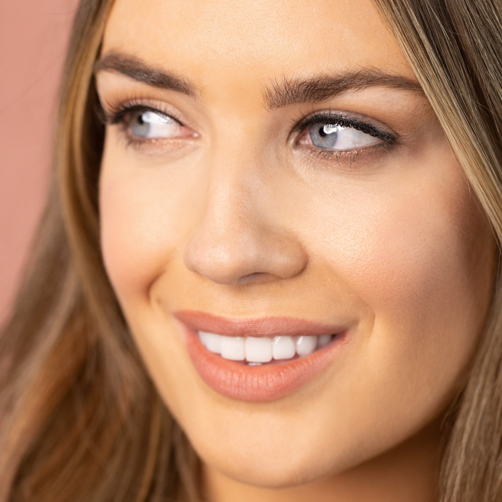 Model wearing Pair of black Silk luxury false eyelashes in elegant lash style.