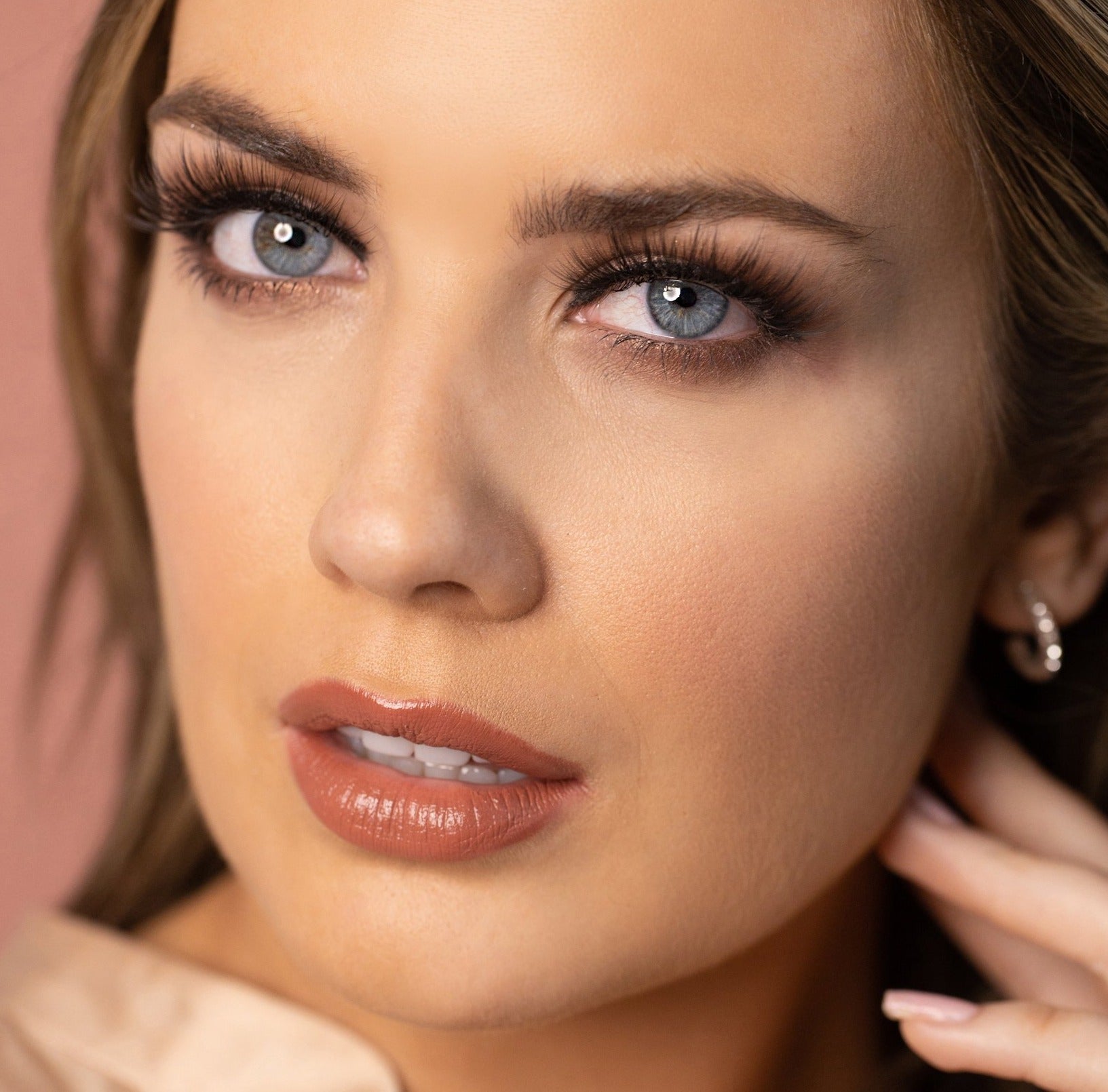 model wearing black Silk luxury false eyelashes. Peacocking bold high volume eyelash style