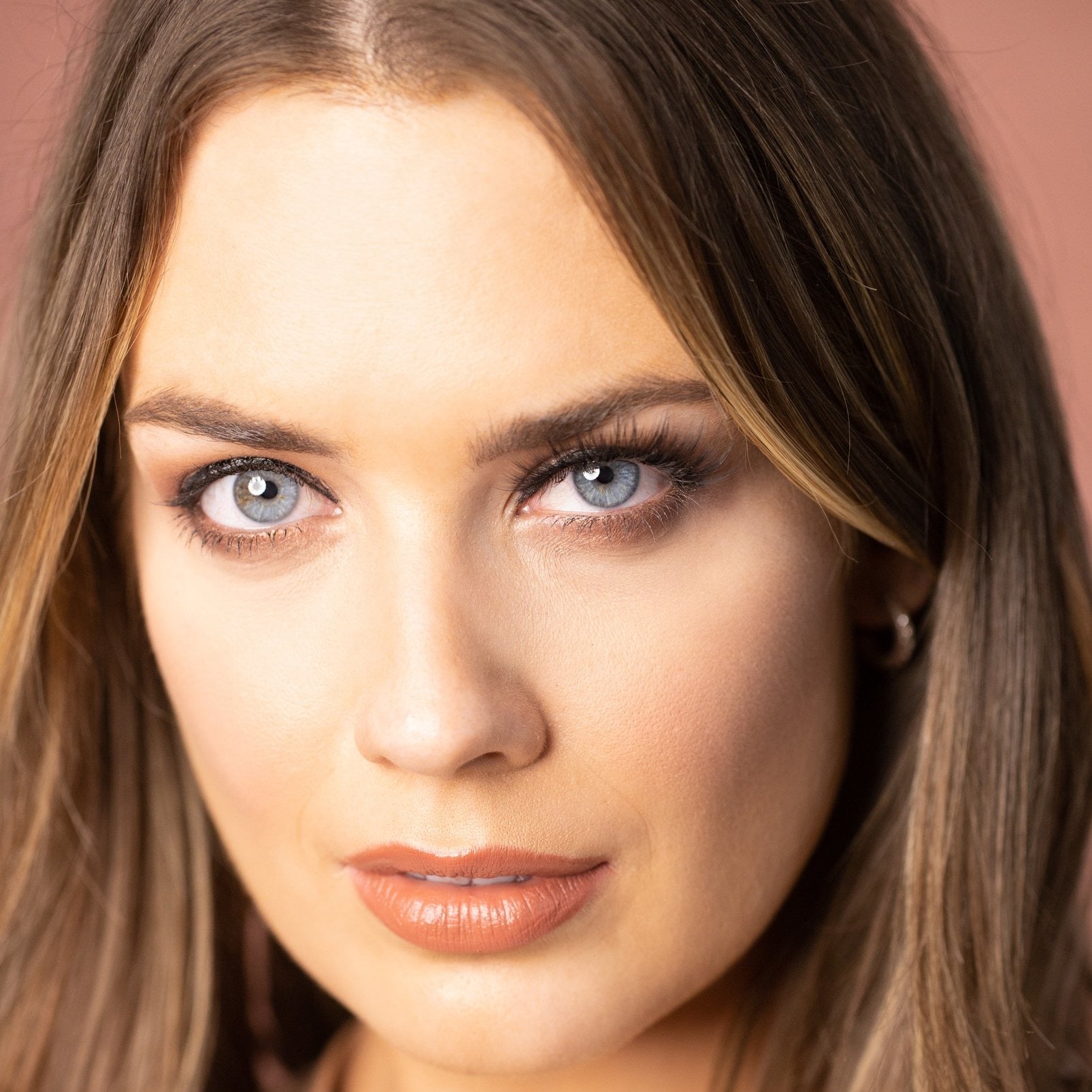 Model wearing black vegan Silk luxury false eyelashes. Peacocking bold high volume eyelash style