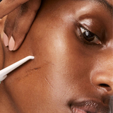 Close up image of a personal dermaplaning the face