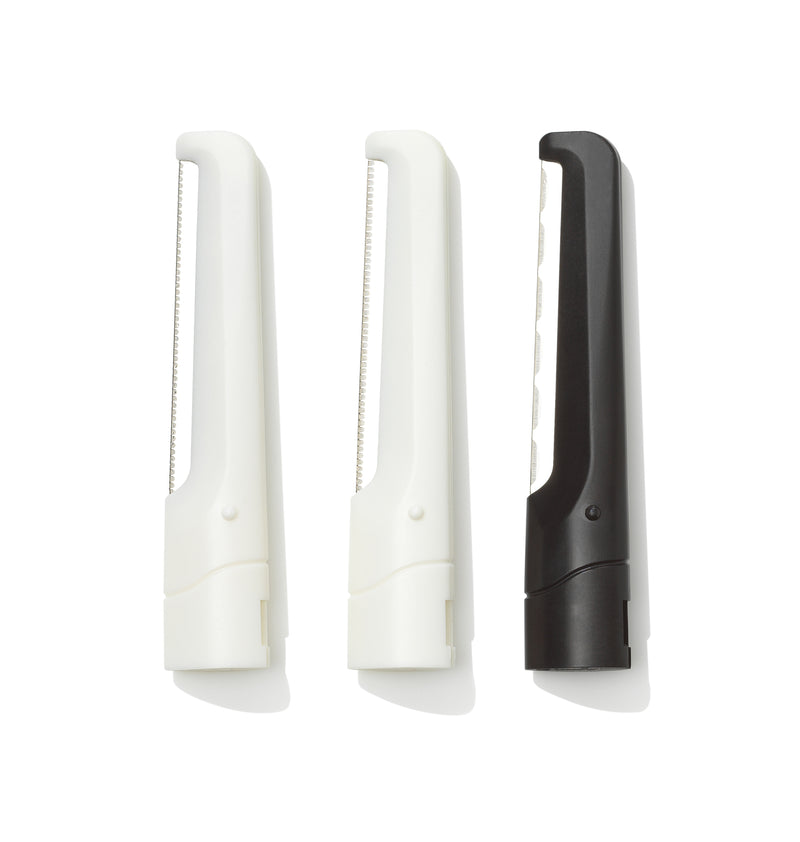 three replacement blades, 2 in white and 1 in black