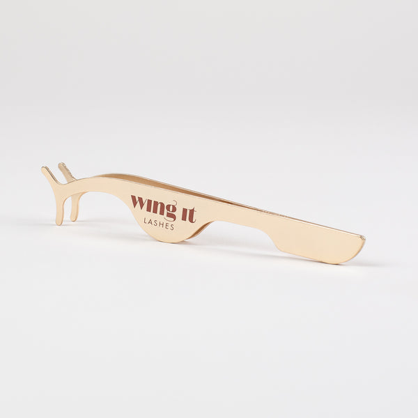 Golden false eyelash applicator. 