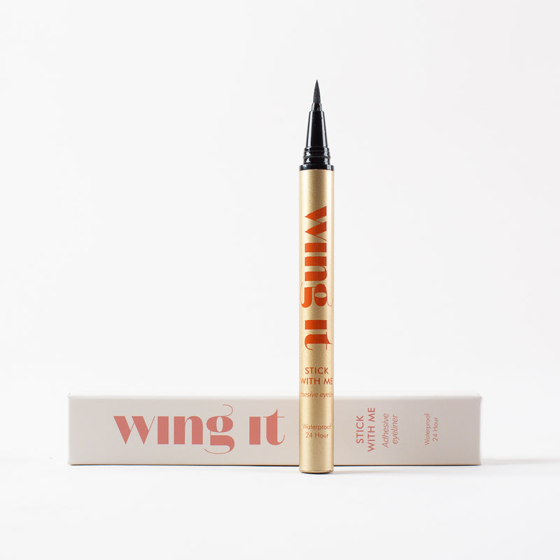 STICK WITH ME adhesive felt tip black eyeliner. Gold tube, cream wing it cosmetics packaging.